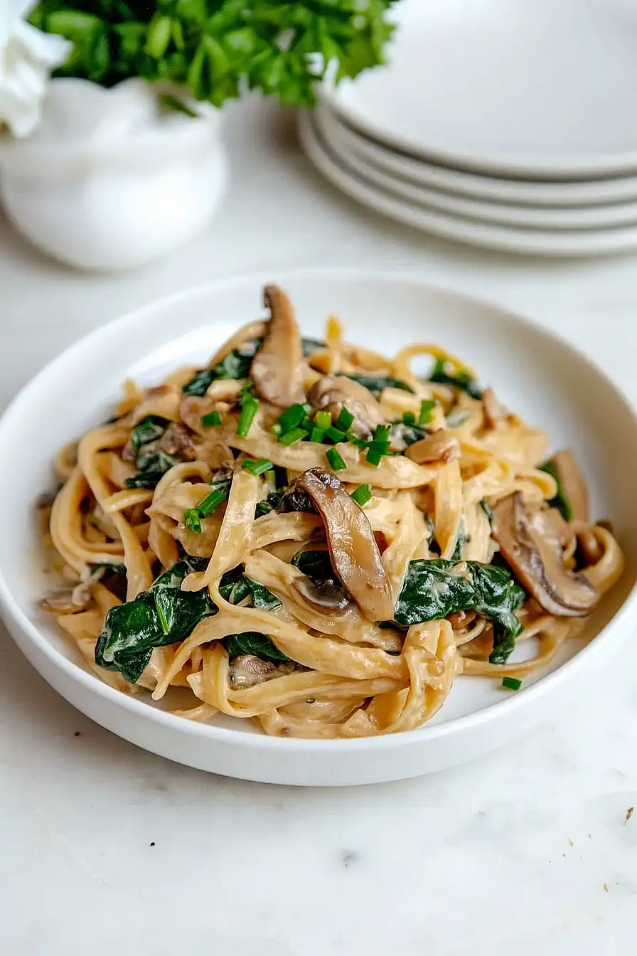 creamy mushroom and spinach pasta with caramelized onions