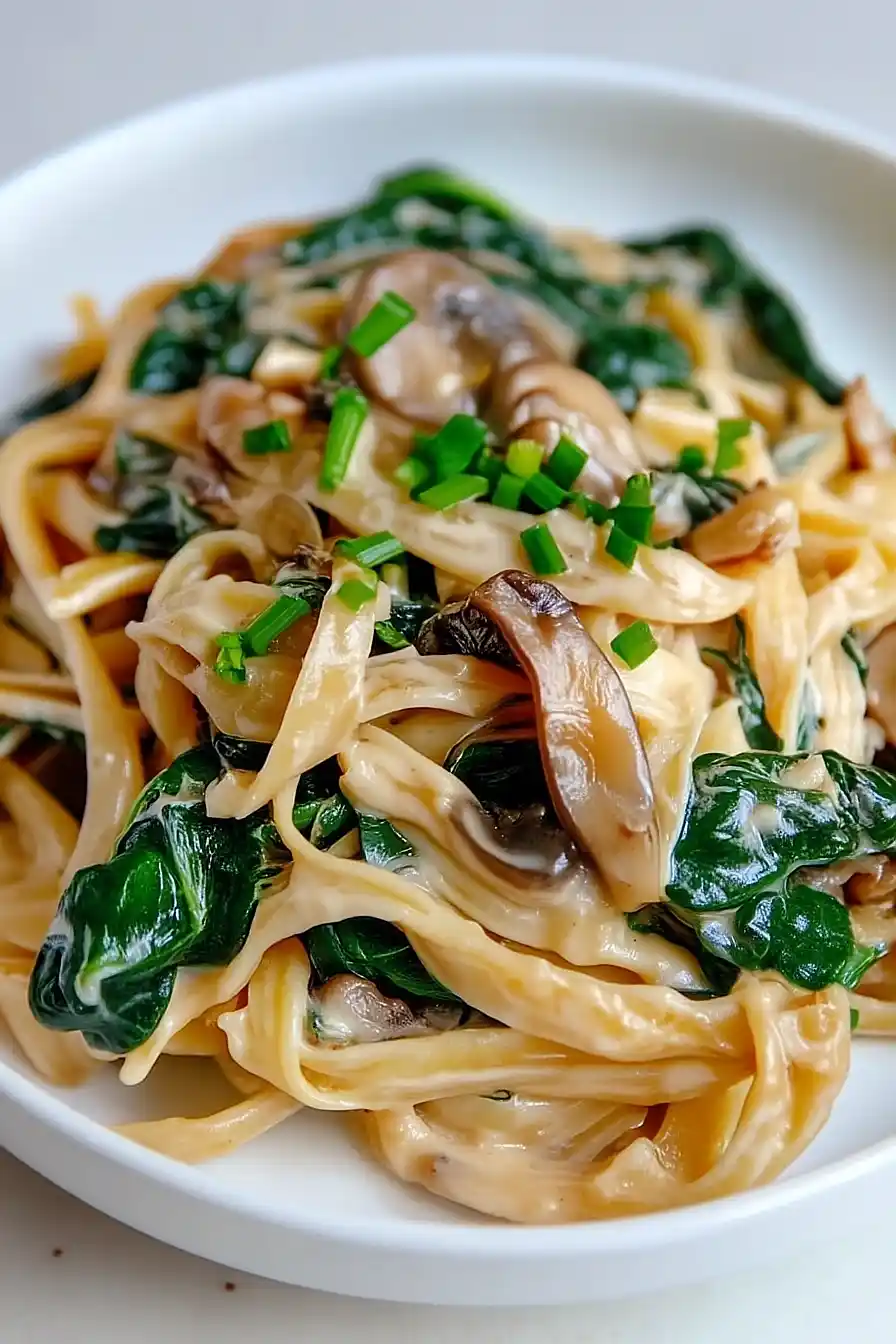creamy mushroom and spinach pasta with caramelized onions