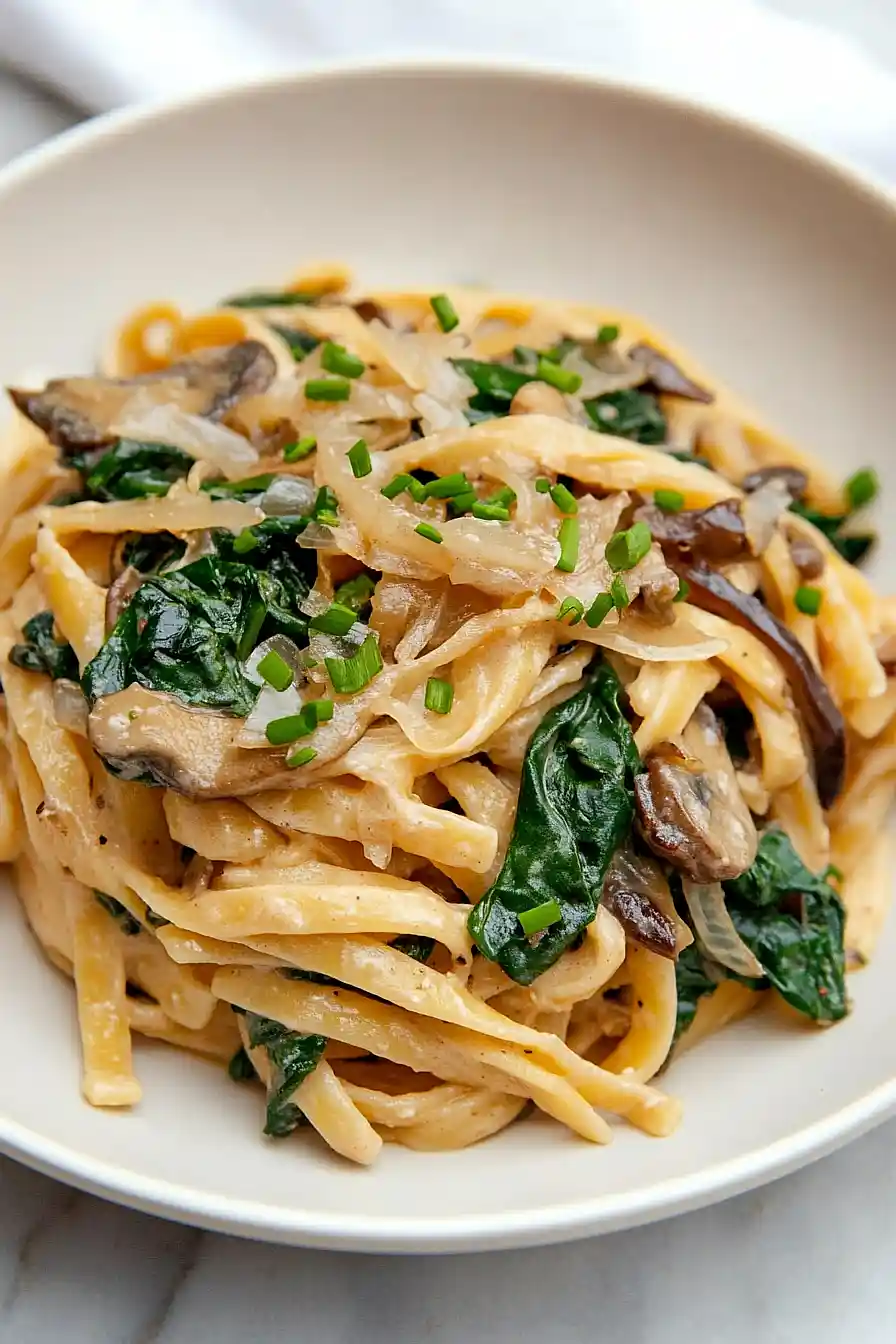 creamy mushroom and spinach pasta with caramelized onions