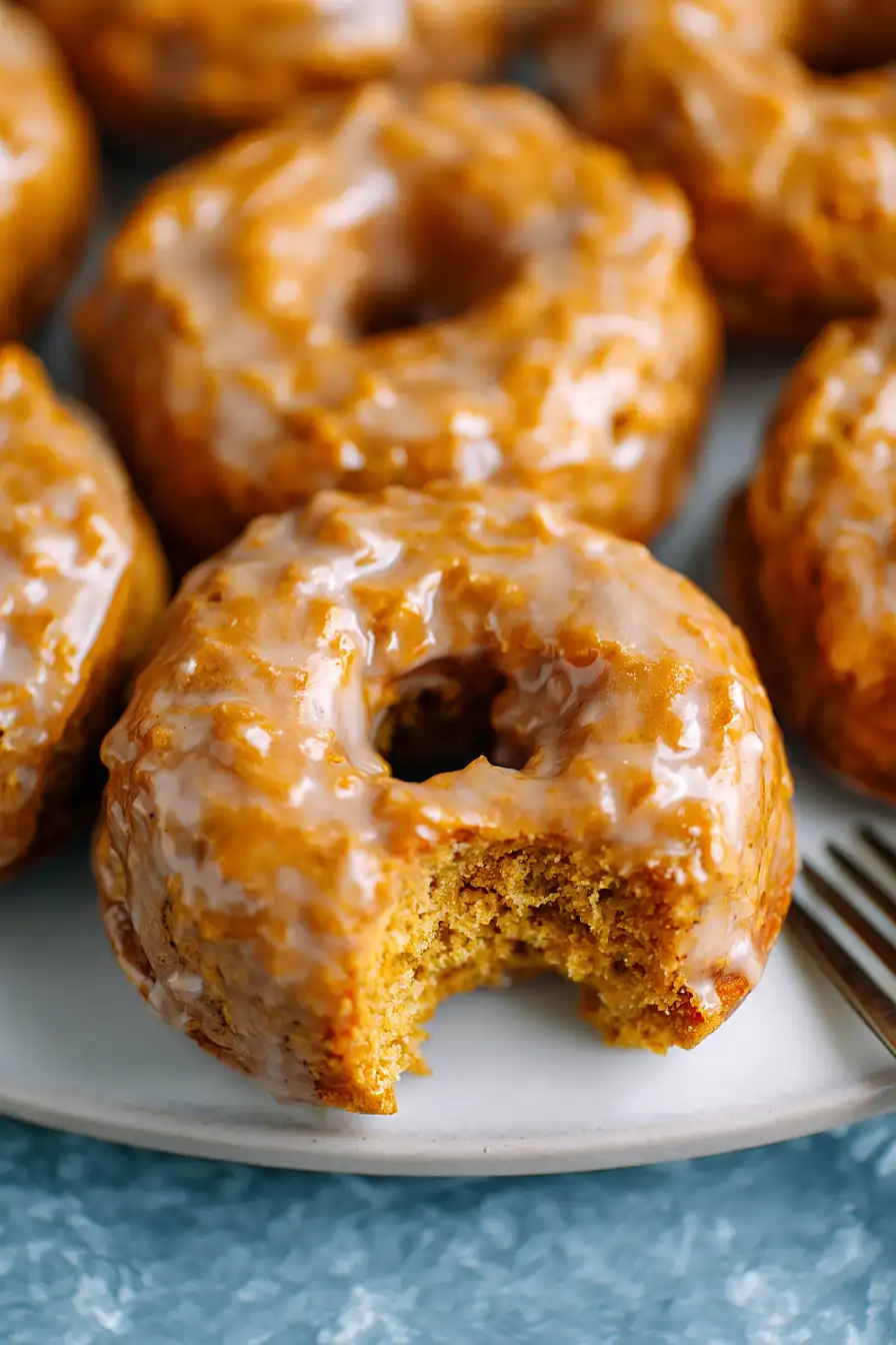 baked pumpkin donuts with maple glaze